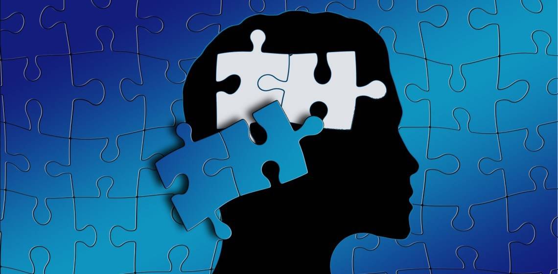 puzzle pieces over brain