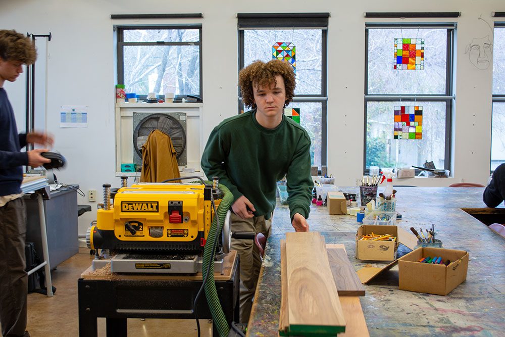 A student working in woodshop class
